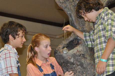 children examine treasure