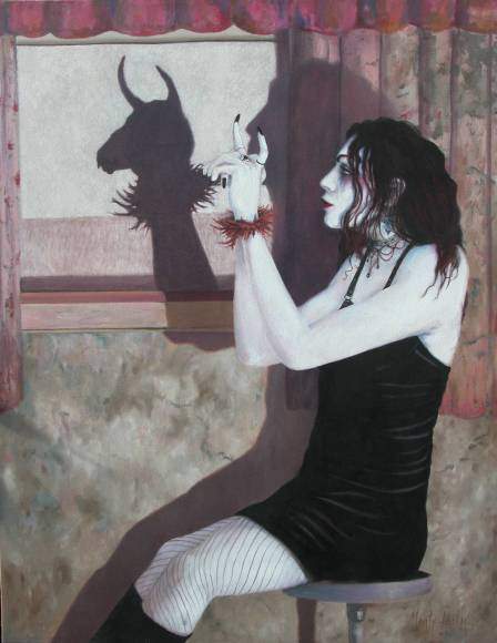 Goth woman sitting on a stool, creating a shadow pupped of a bull on the screen behind her.