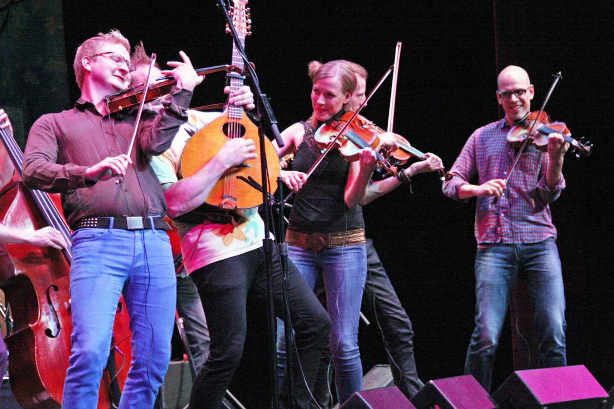 string players performing on stage