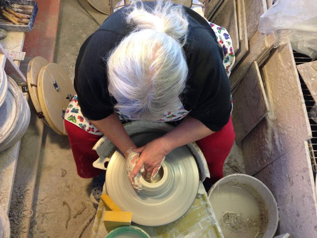 potter at her wheel, as seen from above