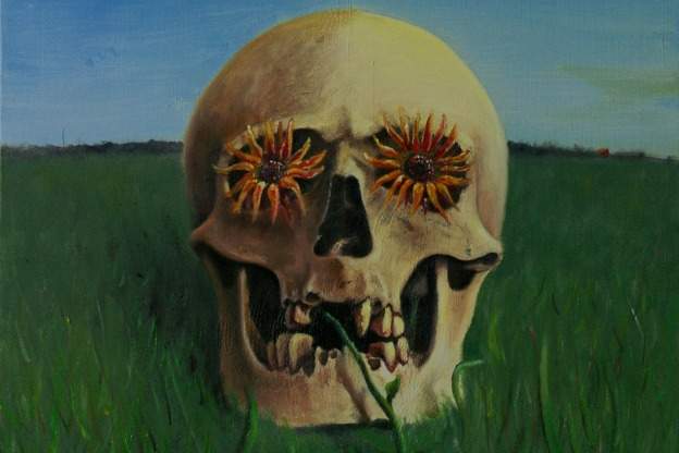 painting of skull on grass