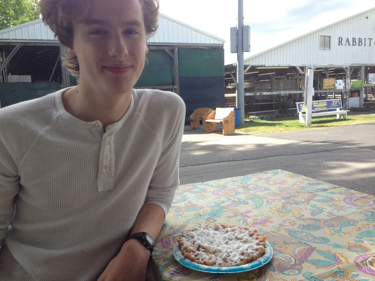 Picture of man with funnel cake at county fair
