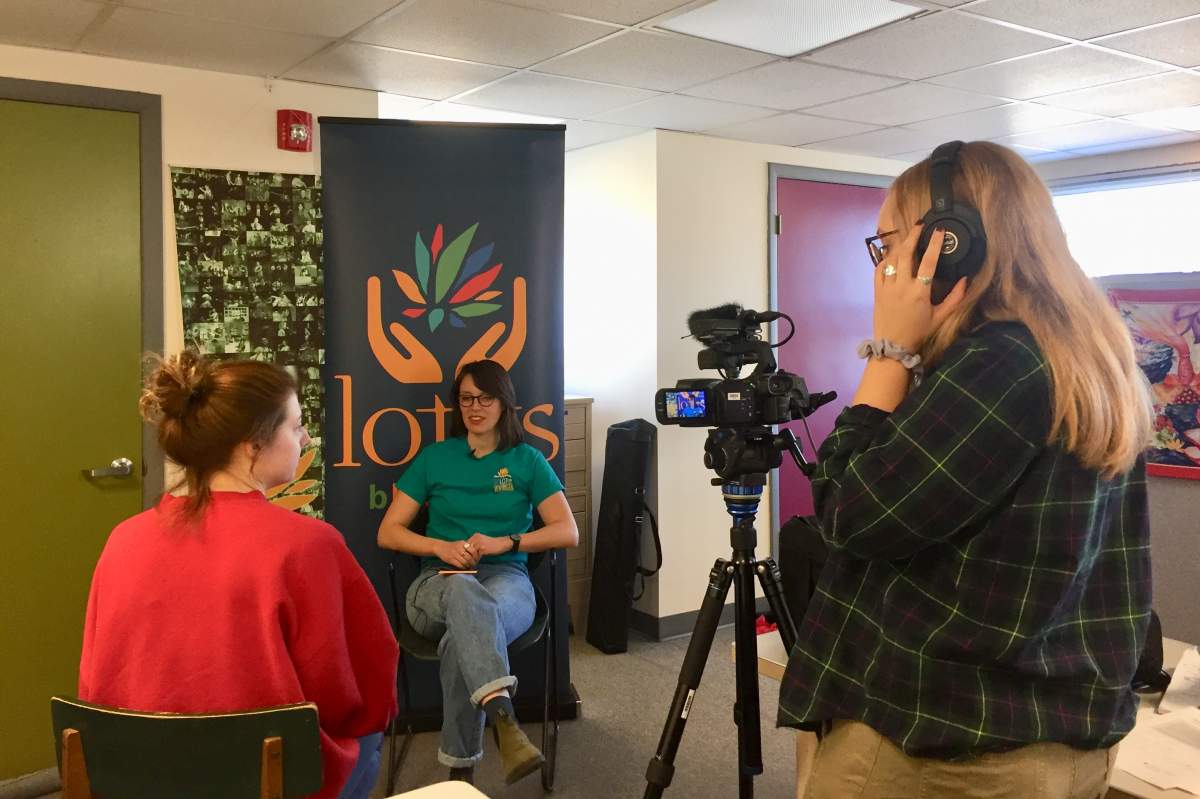 Students conduct an interview for the “Stories of Peace” project.