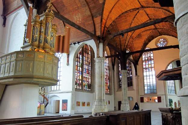 An interior photograph of the Oude Kerk in Amsterdam.
