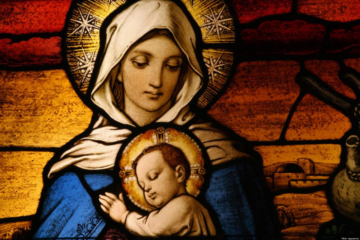 Stained glass depicting the Virgin Mary holding baby Jesus.