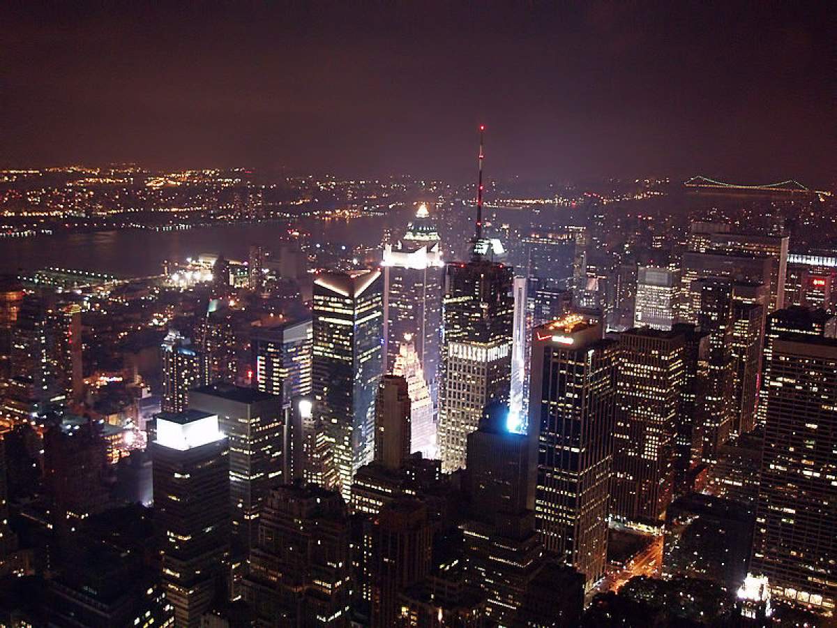 A view of Times Square and New York City at night from atop the Empire State Building.