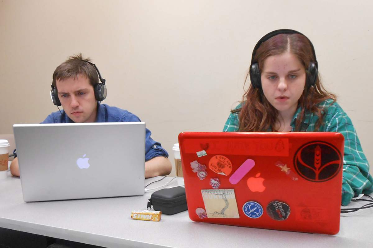 Transom workshop participants James Gray and Colleen Leahy working intently on their laptops