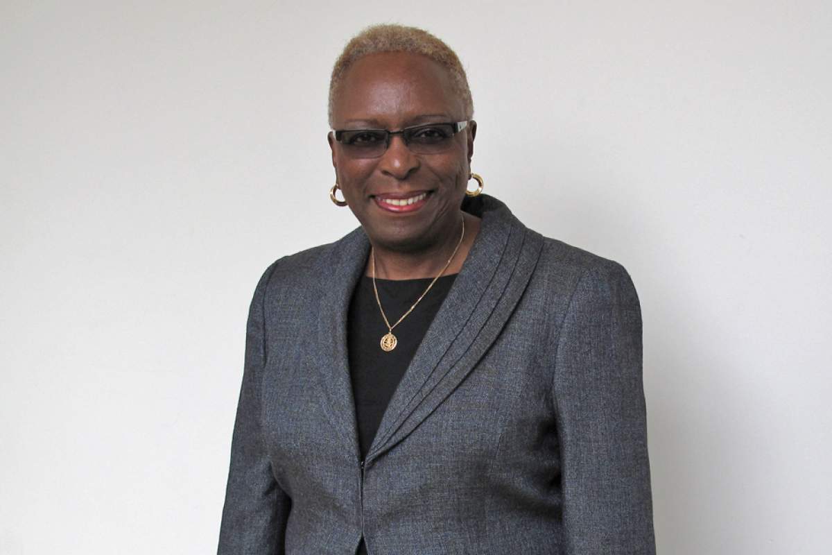 Lillian R. Dunlap, Ph.D in glasses, black blouse, gray jacket