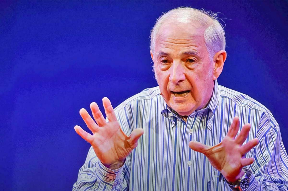 John Searle lecturing, gesturing with hands