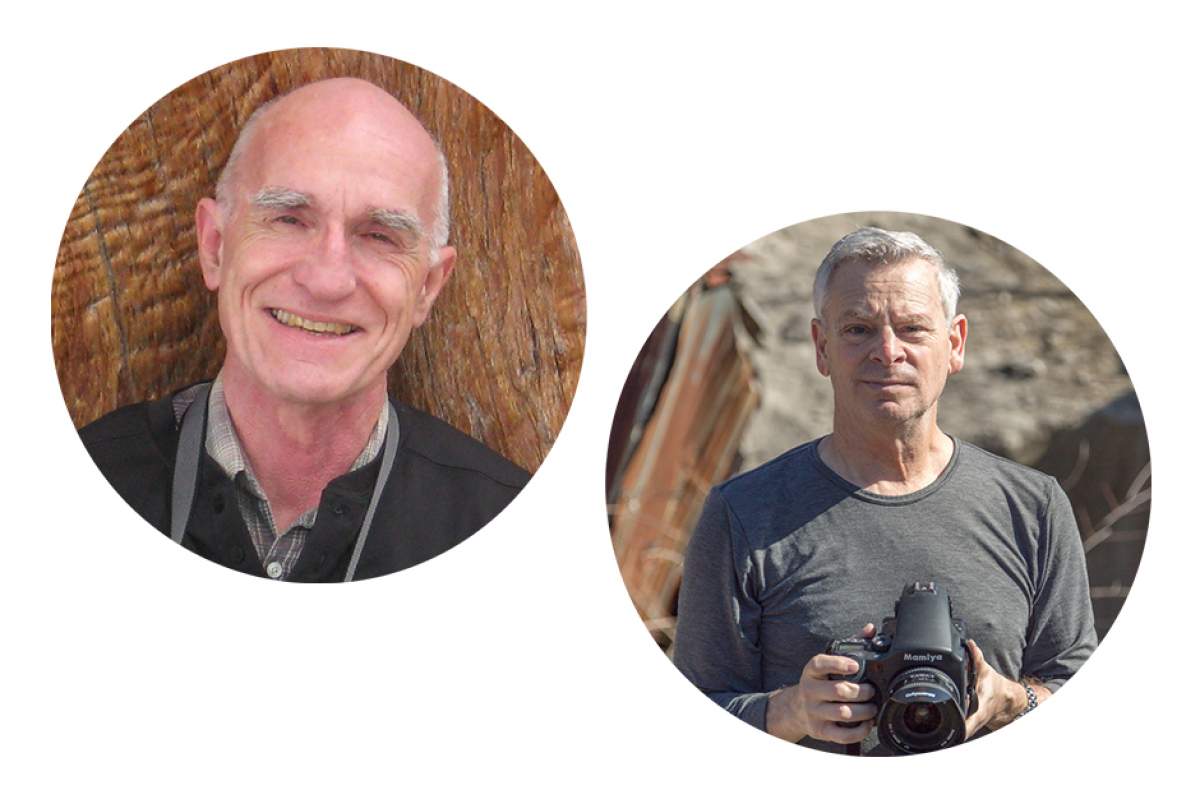 Scott Russell Sanders smiling, Jeffrey Wolin with serious expression, holding digital SLR camera