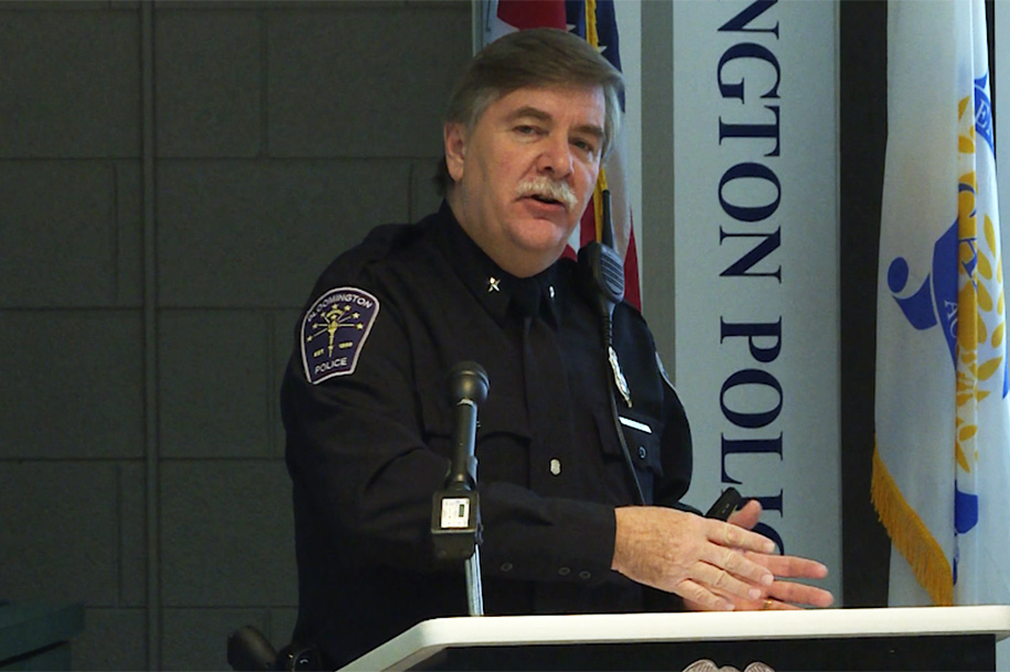 Police chief Mike Diekhoff at a podium in uniform