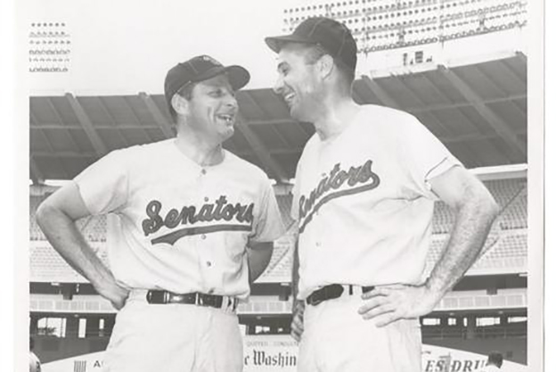 Birch bayh and lee hamilton in baseball uniforms on a baseball field