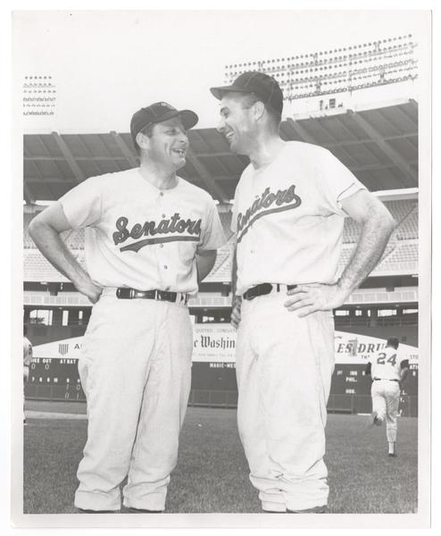 birch bayh and lee hamilton stand on a baseball field in baseball uniforms