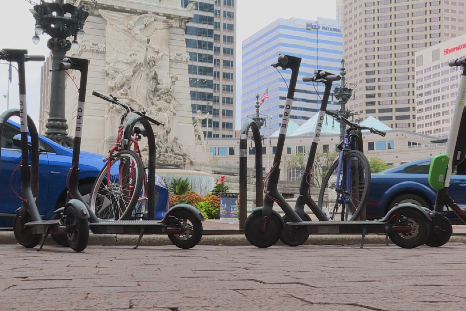 A cluster of electric rental scooters near Monument Circle in Indianapolis