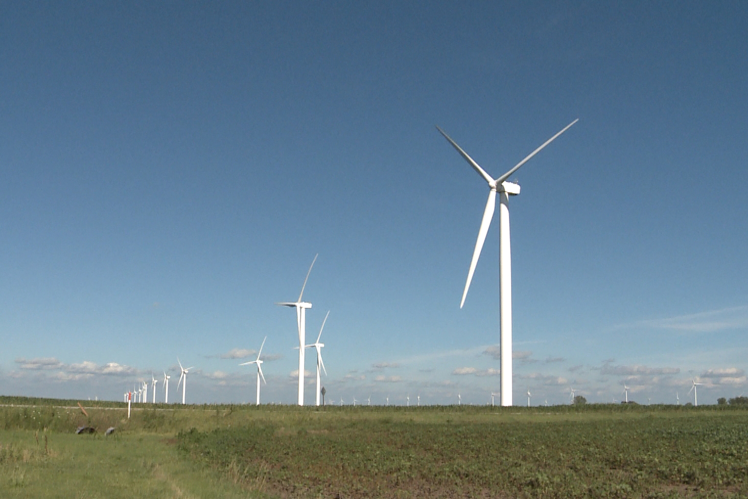 Several wind turbines in a field