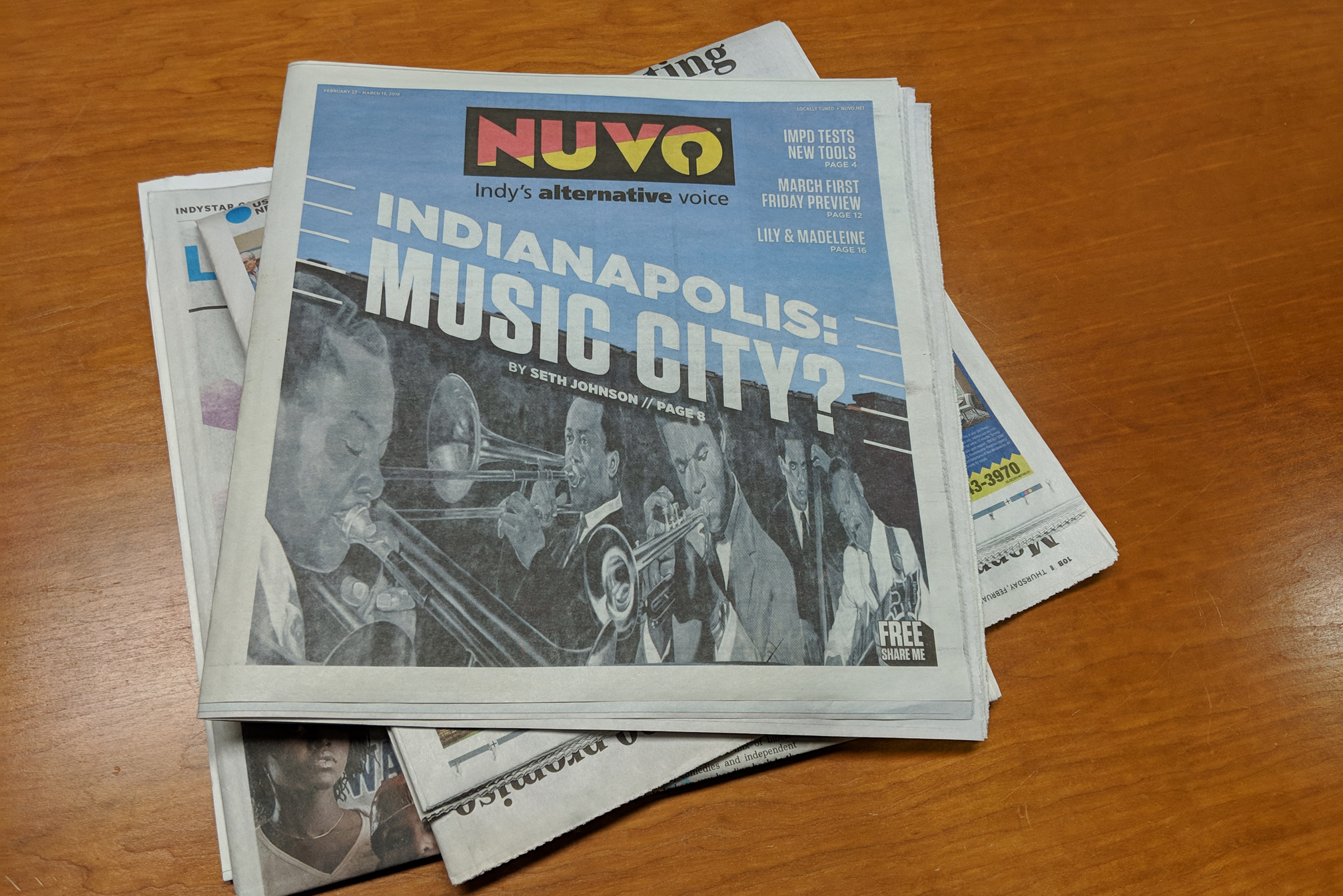 A printed copy of NUVO on a table