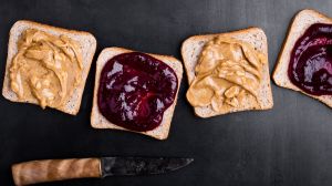 Peanut butter and jelly spread on pieces of bread