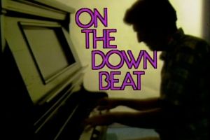 On the Downbeat's title slate featuring the silhouette of a man playing piano.