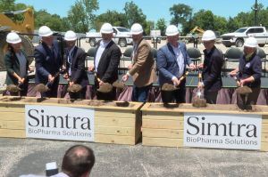 Holcomb and other officials at Simtra expansion groundbreaking June 11, 2024.