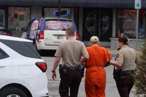 Brittany Fortinberry guided to a Morgan County Jail transport vehicle.