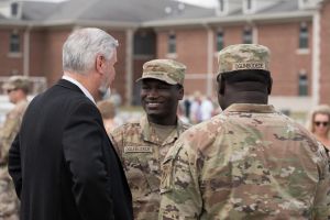 Gov. Eric Holcomb with two members of the Indiana National Guard