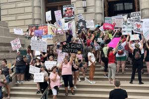 Anti-abortion and abortion rights activists line up on the Indiana Statehouse steps on July 25, 2022, as state lawmakers work on a near-total abortion ban. 