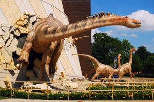 Dinosaurs appear to breakout of the facade of the Indianapolis Children's Museum in Indiana