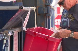 Man recycles at solid waste management district