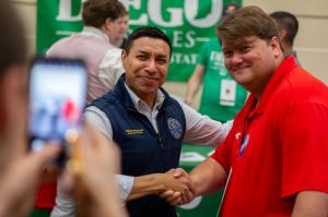 Indiana Secretary of State Diego Morales chats with voters at a campaign event earlier this year.