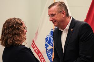U.S. Department of Veterans Affairs Secretary Doug Collins, right, greets an employee at the Roudebush Veterans Affairs Medical Center in Indianapolis on May 29, 2025.