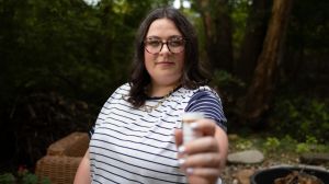 woman holding pill bottle