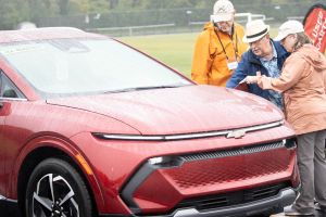 Stacy Milheiser (right), with engineer John Heichelbech (left) and Richard Steiner are judging the new electric vehicles (EV) on display from local dealerships at the third annual EVs 4 EVVeryone in Evansville, Saturday, Sept. 28. 