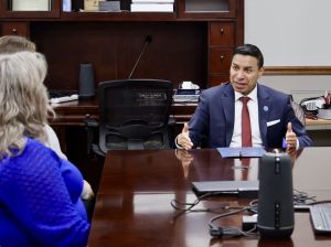 Indiana Secretary of State Diego Morales, center, meets with Scott County leaders in February 2025.