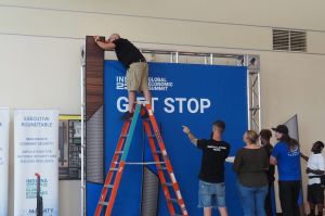  Installation staff works on signage for the 2024 Global Economic Summit in the Indiana Convention Center on Tuesday, May 21, 2024.