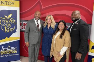 teacher of the year posing for photo with Indiana's secretary of education