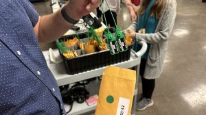 Deputy Director of Elections Brent Stinson displays a green seal that will be used to lock down a ballot scanner during Marion County’s public test day on Oct. 4. They are used to indicate potential tampering. Each seal has a unique serial number.