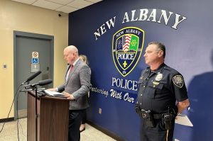 At podium: Floyd County Prosecutor Chris Lane addresses news media. (to the right is New Albany Police Chief Todd Bailey.)