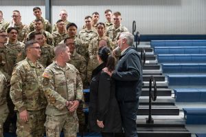 Gov. Holocmb and First Lady Janet Holcomb talk with Indiana National Guard members March 28, 2024, during a Indiana National Guard departure ceremony at Camp Atterbury for guardsmen headed to Texas to support operation Lone Star.