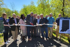 Gov. Eric Holcomb cuts the ribbon on a 2.8-mile extension of the C&O Greenway in Merrillville, Indiana.