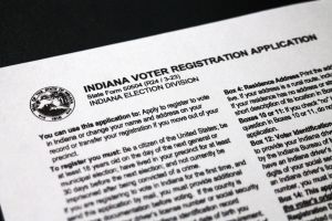 A voter receives their identification from a poll worker during the 2024 primary.