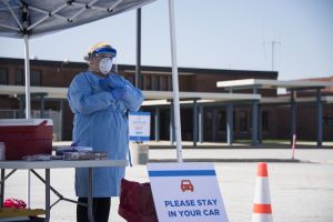 An Indiana State Department of Health nurse participates in a drive-thru COVID-19 testing site at Merrillville High School, Merrillville, Indiana on April 8, 2020.