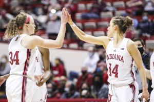 Indiana's Grace Berger and Ali Patberg celebrate on the court.
