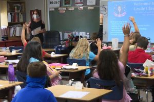Teacher and students in classroom at a Logansport school
