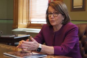 Indiana Supreme Court Chief Justice Loretta Rush sitting at a table