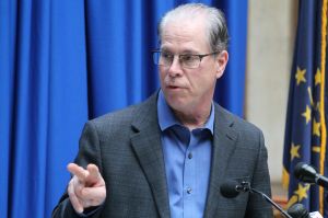 U.S. Senator Mike Braun speaks at a podium.