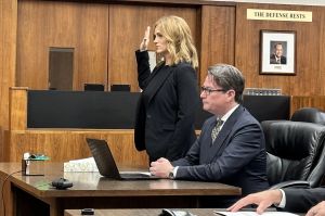 Brittany Fortinberry guided to a Morgan County Jail transport vehicle.