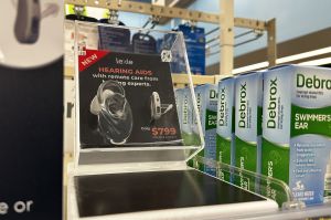 An over-the-counter hearing aid in a display case at Walgreens.