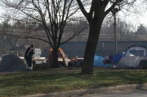 A photo of tents lined along College Avenue on the westside of Seminary Park.