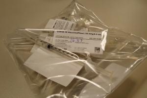 Doses of the COVID-19 vaccine are readied for use.