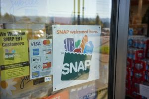 "SNAP welcomed here" sign is seen at the entrance to a Big Lots store in Portland, Oregon. The Supplemental Nutrition Assistance Program (SNAP) is a federal program